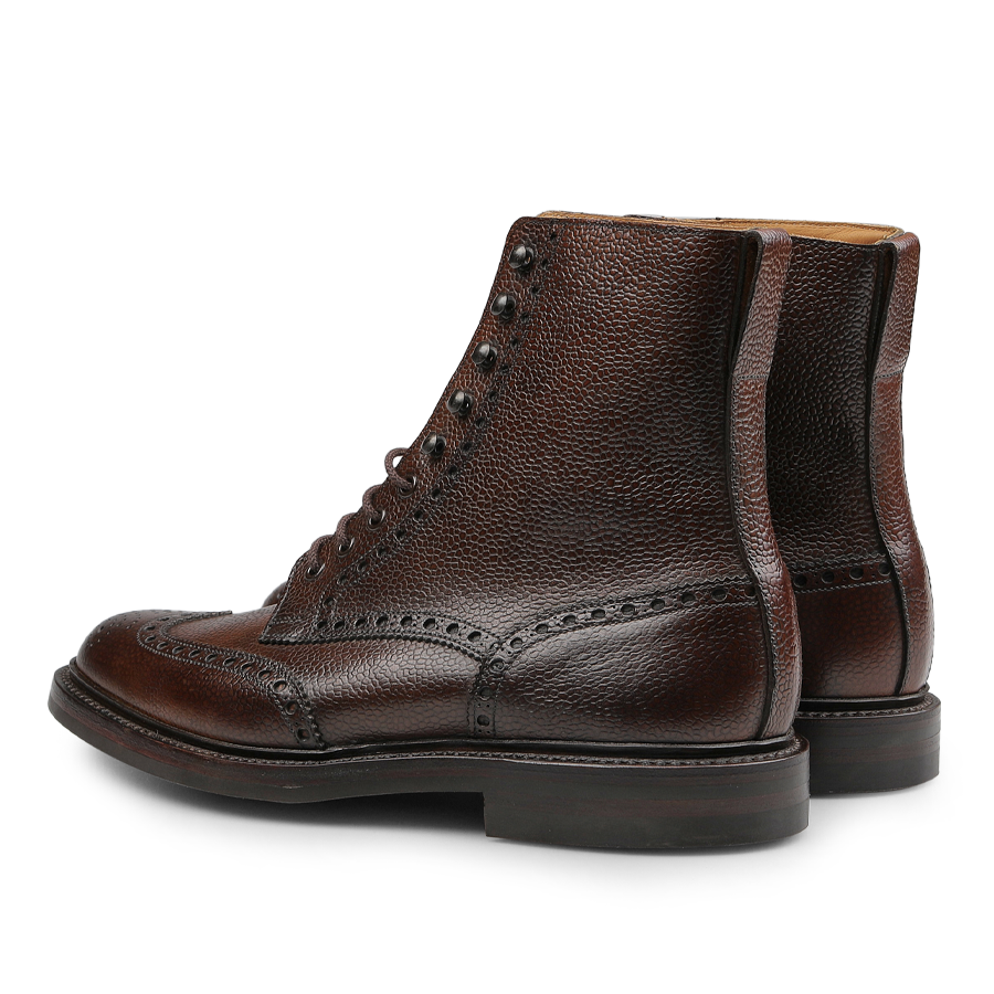 Crafted by Crockett & Jones, the Dark Brown Scotch Grain Leather Islay Boots boast a rich brown Scotch grain calf leather with textured detailing and a timeless lace-up design.