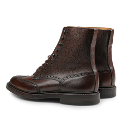 Crafted by Crockett & Jones, the Dark Brown Scotch Grain Leather Islay Boots boast a rich brown Scotch grain calf leather with textured detailing and a timeless lace-up design.