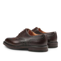 The Dark Brown Scotch Grain Leather Pembroke Brogues by Crockett & Jones, crafted with decorative perforations and laces, are displayed from a rear-side view on a plain white background.