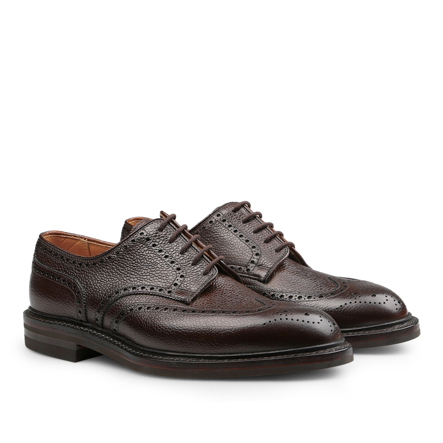 The Dark Brown Scotch Grain Leather Pembroke Brogues from Crockett & Jones are expertly crafted, featuring laces and classic perforated detailing.