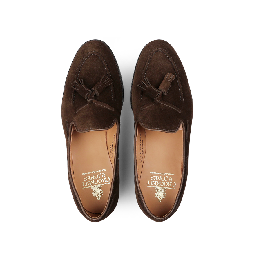 Top view of a pair of Dark Brown Suede Leather Cavendish II loafers, elegantly designed with tassels on the upper and featuring "Crockett & Jones" branding on the insole.