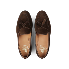 Top view of a pair of Dark Brown Suede Leather Cavendish II loafers, elegantly designed with tassels on the upper and featuring "Crockett & Jones" branding on the insole.