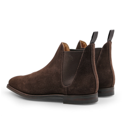 The Crockett & Jones Dark Brown Suede Leather Chelsea VIII Boots are elegantly designed with elastic side panels and pull tabs, featuring a classic style enhanced by Goodyear welted construction, as seen from the back.