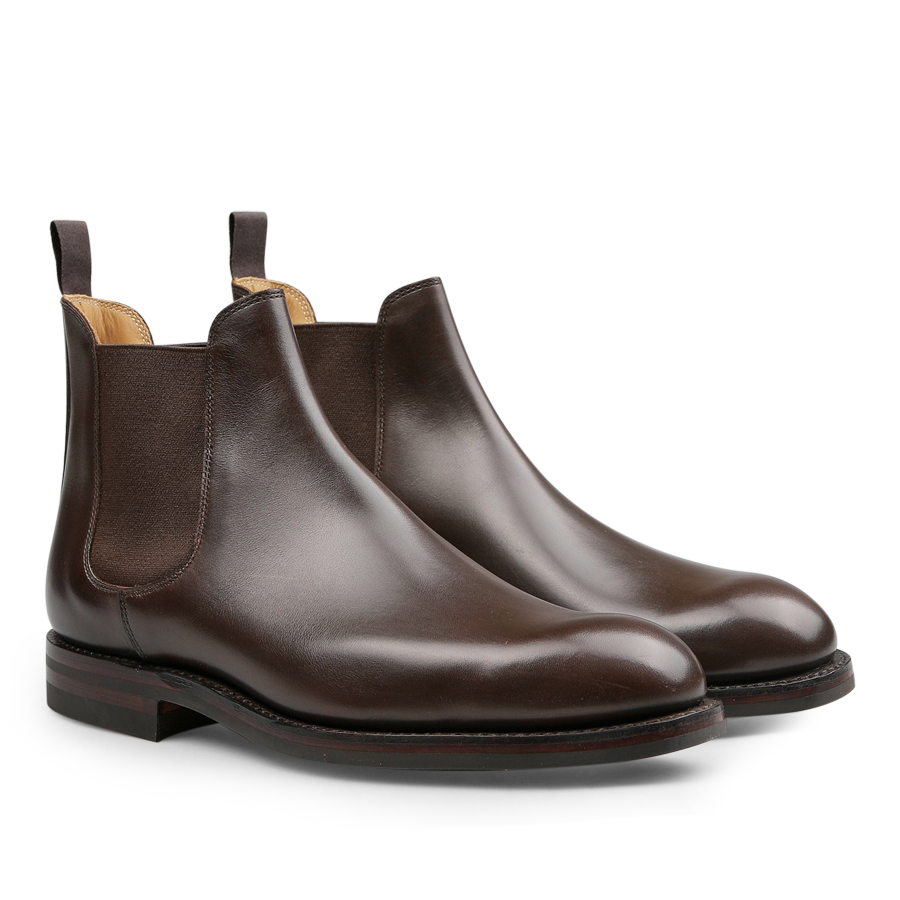 Crockett & Jones presents the Dark Brown Wax Calf Leather Chelsea V Boots, designed with elastic side panels and pull tabs, and crafted with a durable Goodyear welted sole.