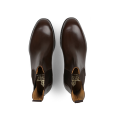 A pair of Dark Brown Wax Calf Leather Chelsea V Boots by Crockett & Jones, crafted from polished leather and viewed from above.