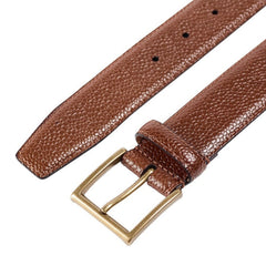 Close-up of the Crockett & Jones Tan Scotch Grain Leather 32mm Belt, highlighting a gold-colored buckle and multiple size-adjustment holes that showcase the brand's exceptional craftsmanship.