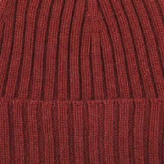 Close-up of the Burnt Red Ribbed Cashmere Beanie, crafted by Italian knitwear specialist Daniele Fiesoli using upcycled cashmere.