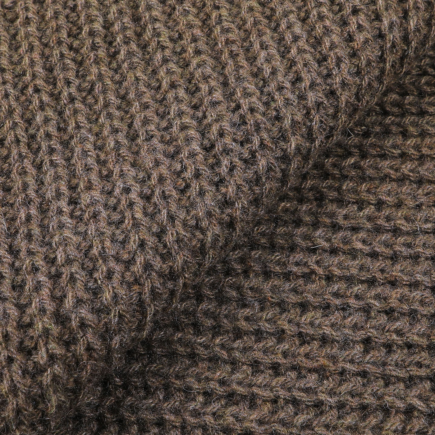 Close-up of the Corteccia Brown Cable Knit Cashmere Scarf by Daniele Fiesoli, highlighting its upcycled cashmere fabric with a coarse texture and large, distinct stitches.