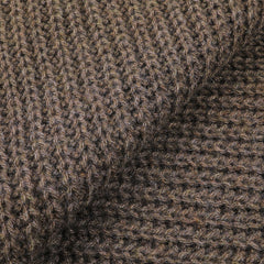 Close-up of the Corteccia Brown Cable Knit Cashmere Scarf by Daniele Fiesoli, highlighting its upcycled cashmere fabric with a coarse texture and large, distinct stitches.