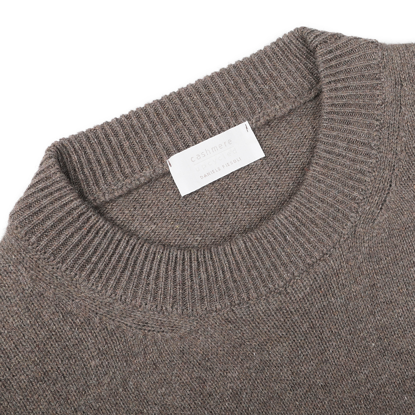 Close-up of an Italian knitwear piece, highlighting the Corteccia Brown Cashmere Crewneck Sweater by Daniele Fiesoli, with a visible label inside the collar.