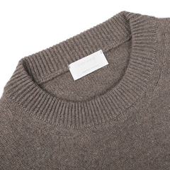 Close-up of an Italian knitwear piece, highlighting the Corteccia Brown Cashmere Crewneck Sweater by Daniele Fiesoli, with a visible label inside the collar.