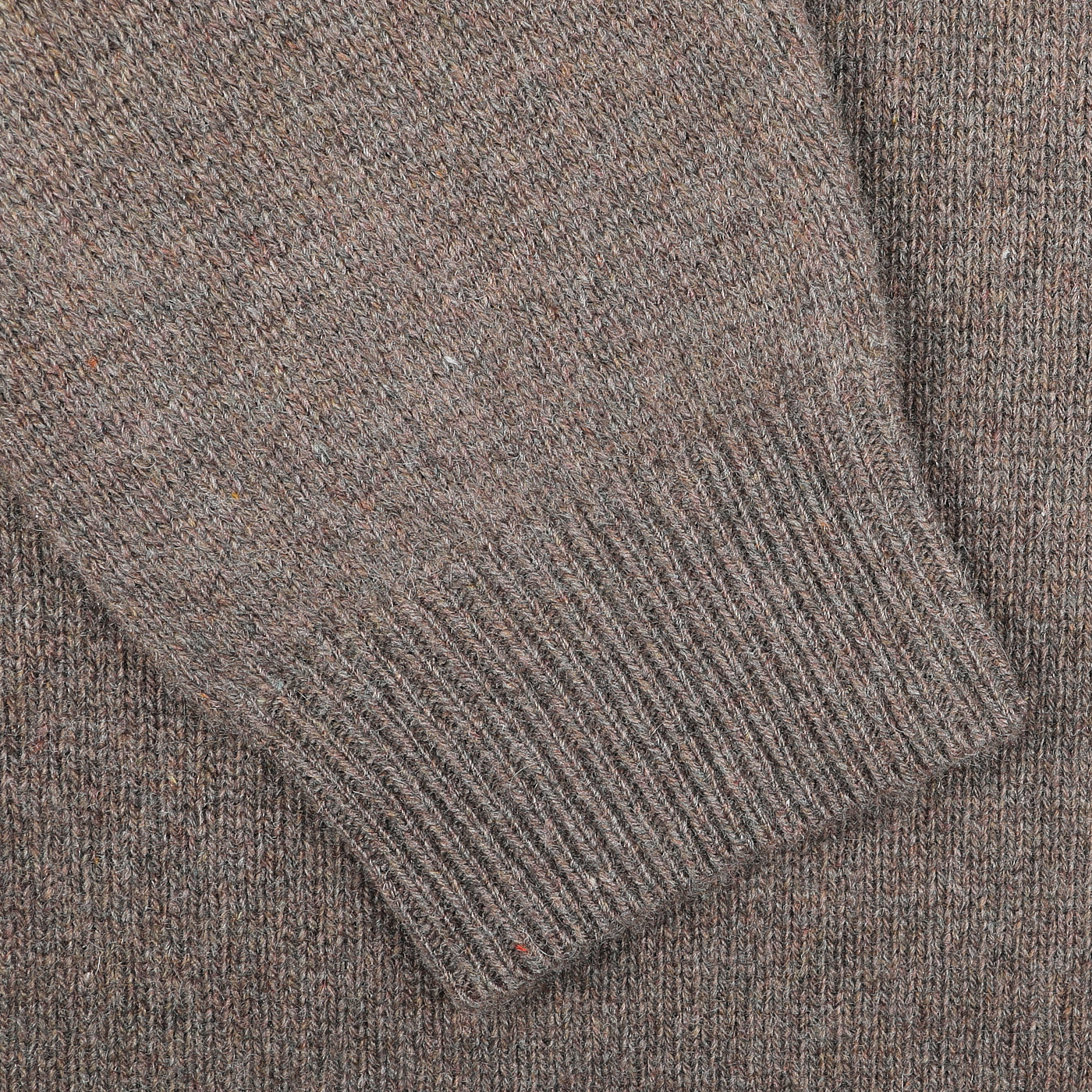 A close-up of the sleeve of the Corteccia Brown Cashmere Crewneck Sweater by Daniele Fiesoli reveals a detailed knit texture, highlighting the craftsmanship behind this stylish Italian knitwear piece.