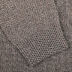 Close-up of a sleeve from Daniele Fiesoli's Italian knitwear masterpiece, showcasing the ribbed cuff detail of the luxurious Corteccia Brown Cashmere V-Neck Sweater.