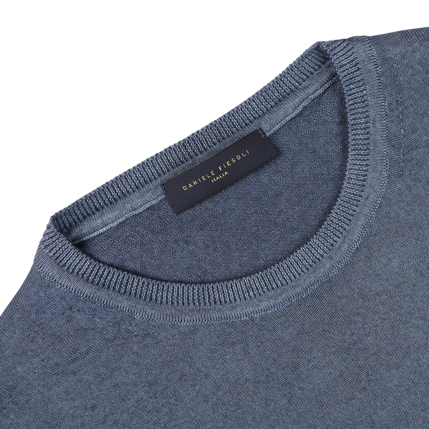 Close-up of a Dark Blue Melange Merino Wool Crewneck, crafted from extra fine merino wool, with a visible neck tag displaying "Daniele Fiesoli" and "Italy.