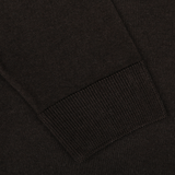 Close-up of a long sleeve with a ribbed cuff on the Dark Brown Merino Wool Crewneck by Daniele Fiesoli, made in Italy.