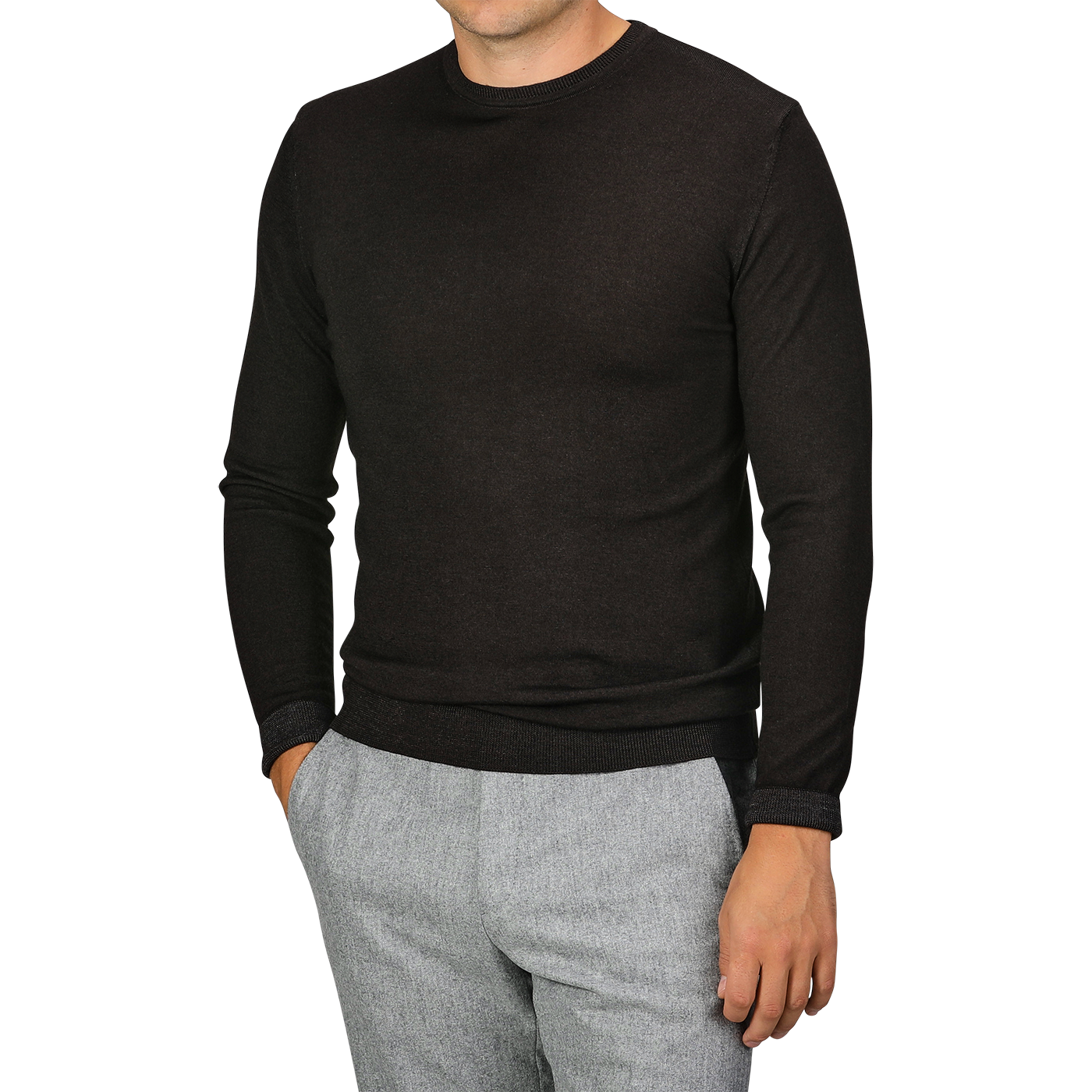 A person wearing a Daniele Fiesoli Dark Brown Merino Wool Crewneck with light gray pants. The individual has one hand in their pocket and is not showing their face.