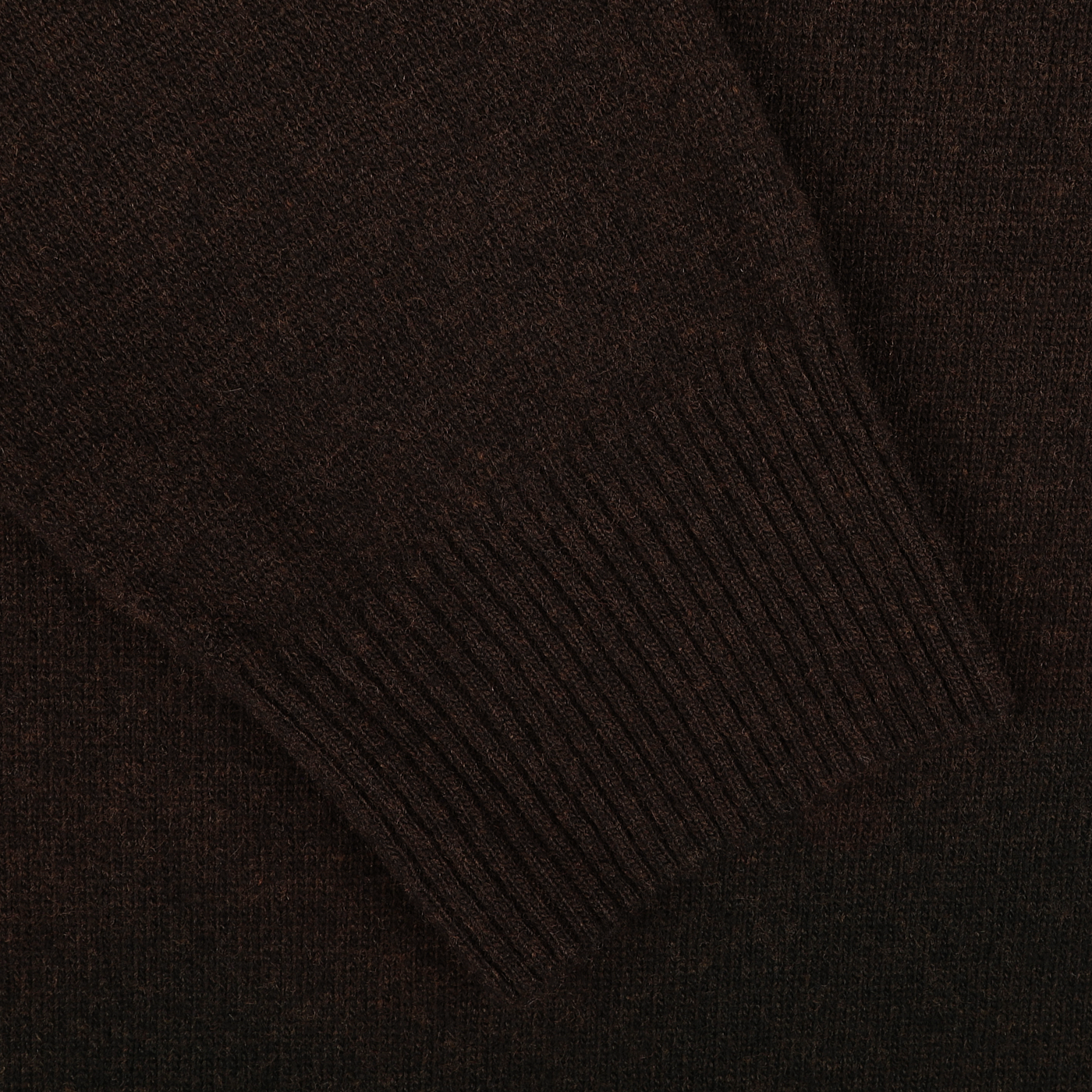 Close-up of a dark brown knitted sleeve with ribbed cuff, part of the luxurious Daniele Fiesoli Dark Brown Wool Cashmere Crewneck sweater, made in Italy from a soft wool-cashmere blend.