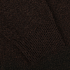 Close-up of a dark brown knitted sleeve with ribbed cuff, part of the luxurious Daniele Fiesoli Dark Brown Wool Cashmere Crewneck sweater, made in Italy from a soft wool-cashmere blend.