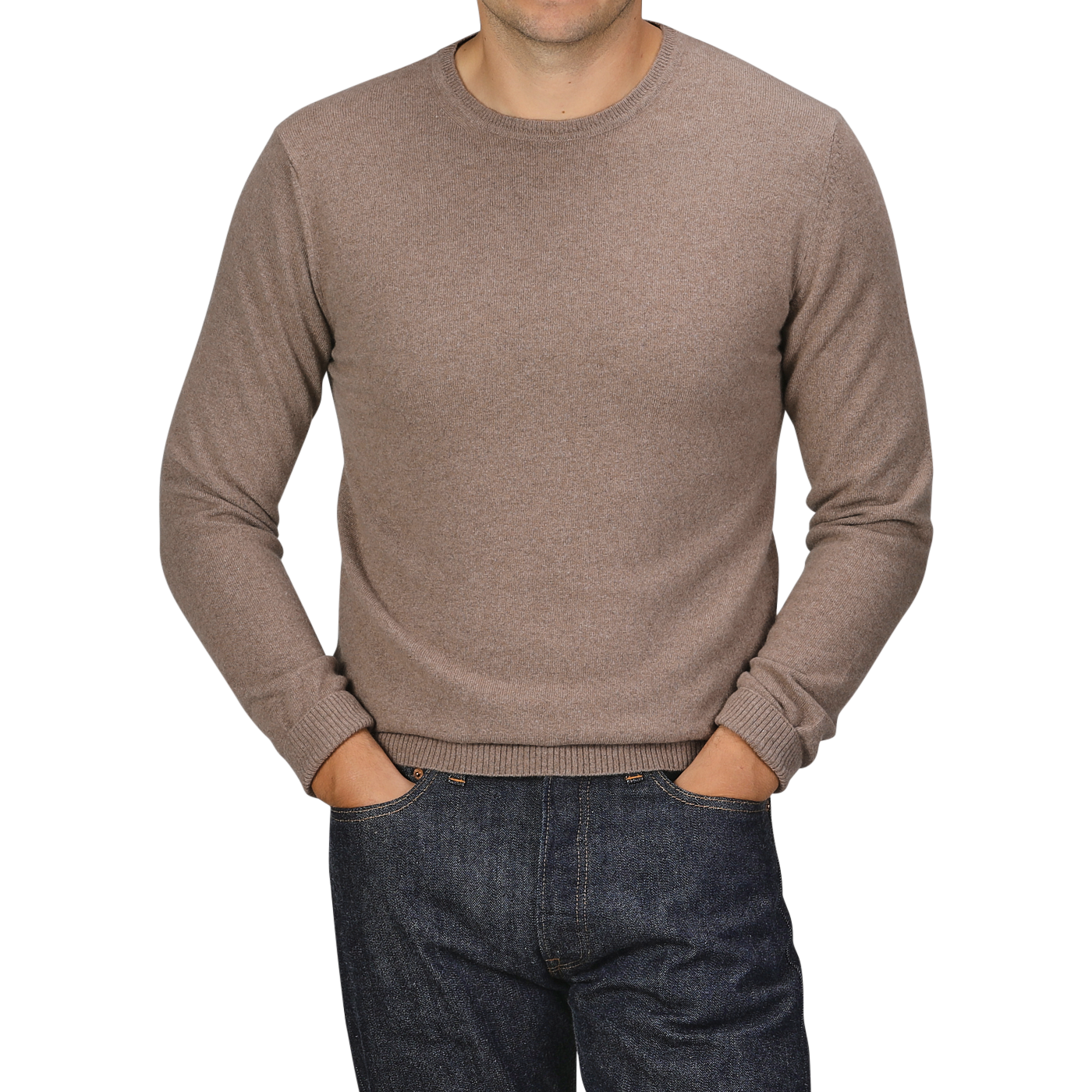 A person wearing a Light Brown Wool Cashmere Crewneck from Daniele Fiesoli and dark jeans with their hands in their pockets, standing against a plain background. The head is cropped out of the image.