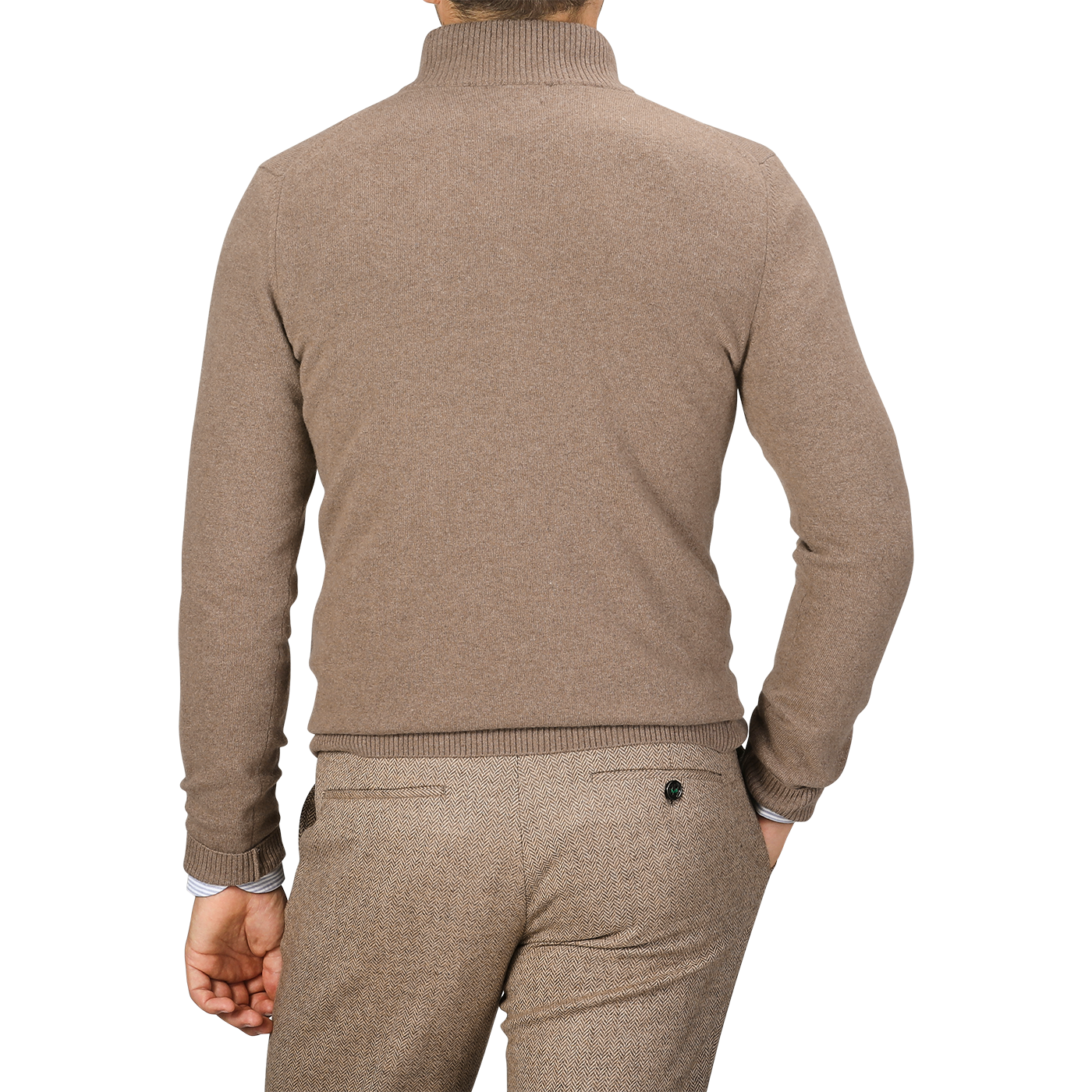 A man is seen from behind wearing a light brown quarter-zip sweater and brown pants. His right hand is in his pocket, showcasing the casual elegance of an absolutely made in Italy wool-cashmere blend garment by Daniele Fiesoli.