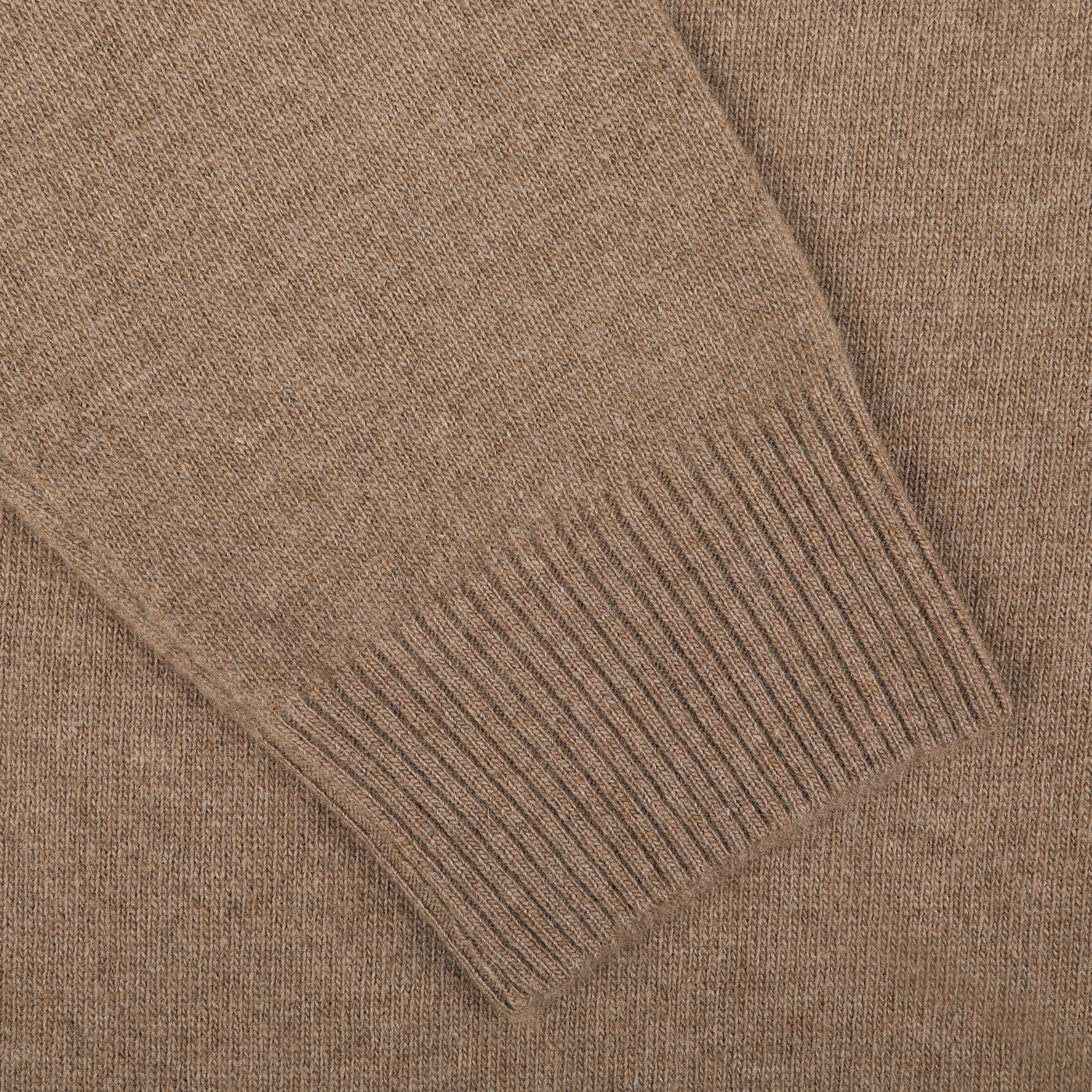 Close-up of a brown knitted sleeve featuring a ribbed cuff, showcasing the luxurious texture of the Light Brown Wool Cashmere Quarter Zip Sweater by Daniele Fiesoli, exquisitely made in Italy.