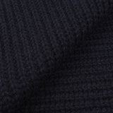 Close-up image of dark navy blue, cable knit fabric from an upcycled Daniele Fiesoli Navy Blue Cable Knit Cashmere Scarf.