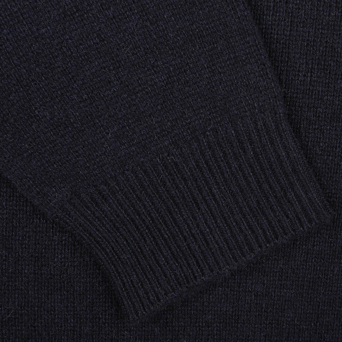 Close-up of a Daniele Fiesoli Navy Blue Cashmere Crewneck Sweater sleeve, highlighting the luxurious texture and ribbed cuff detail.