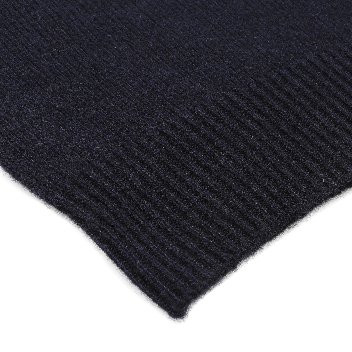 Close-up of the corner of a navy blue ribbed knit fabric, likely from the Daniele Fiesoli Navy Blue Cashmere Crewneck Sweater, with a visible edge texture.