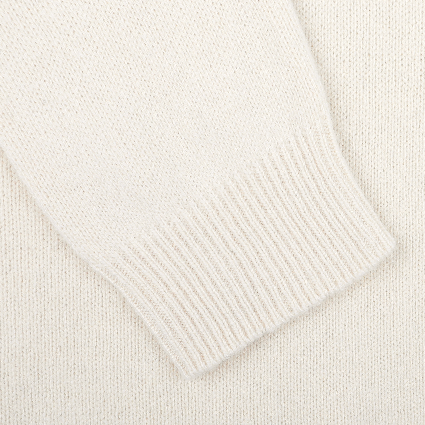 Close-up of the Nuvola Ecru Cashmere Crewneck Sweater by Daniele Fiesoli, highlighting the ribbed cuff and smooth texture, meticulously crafted in Italy.