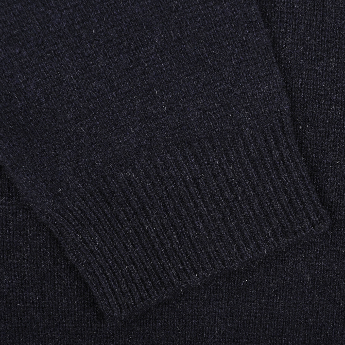 Close-up of the sleeve of the Daniele Fiesoli Navy Blue Cashmere V-Neck Sweater, showcasing the ribbed cuff detail, made from upcycled cashmere.