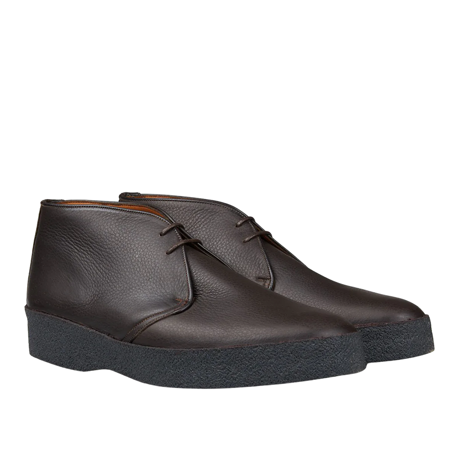 The Dark Brown Savage Grain Hi Top Chukka Boots by Sanders are crafted from savage grain leather and feature black rubber crepe soles and laces.