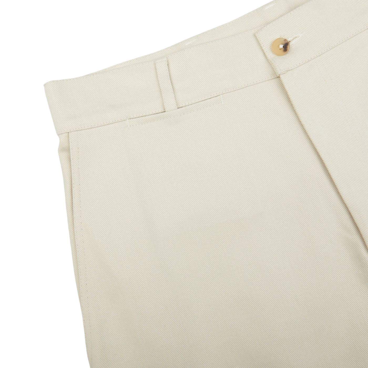 Close-up of a beige De Bonne Facture Undyed Heavy Cotton Drill Balloon Trousers waistband with a button closure.