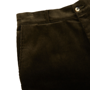 A close up of a pair of Dark Olive Cotton Corduroy Balloon Trousers made from heavy cotton corduroy by De Bonne Facture.