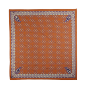 An ornate square scarf featuring a burnt orange center with small white Provençal patterns, bordered by a purple and white decorative frame - Sienna Brown Paisley Cotton Voile Bandana from De Bonne Facture.