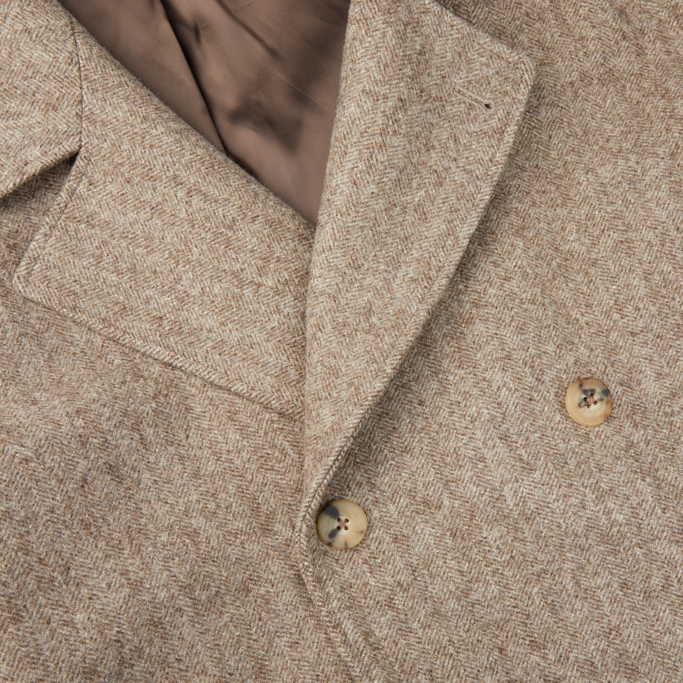 A traditional yet contemporary style Undyed Wool Herringbone Grandad Coat, made with pure wool herringbone fabric and featuring brown buttons by De Bonne Facture.