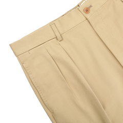 The De Petrillo Beige Cotton Twill Modello E Trousers, featuring pleats, belt loops, and a button closure, are showcased from the waist down against a plain white background.