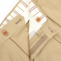 Close-up of De Petrillo's Beige Cotton Twill Modello E Trousers, featuring a button closure, striped inner lining, detailed stitching, and buttonholes. Crafted for style and durability.