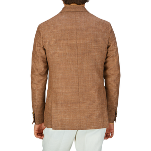 A person from behind wearing a De Petrillo Brown Checked Wool Silk Linen Posillipo Blazer and white pants.