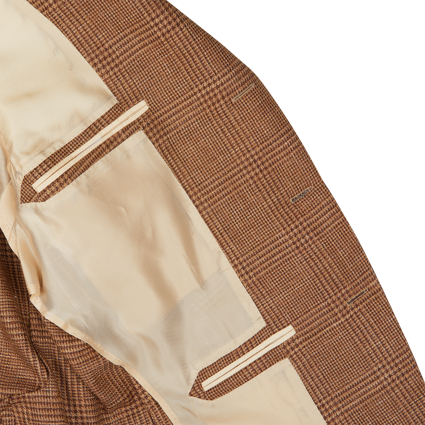 Detail of a De Petrillo Brown Checked Wool Silk Linen Posillipo Blazer with white lining and pocket trim on a patterned background, showcasing exquisite tailoring skills.