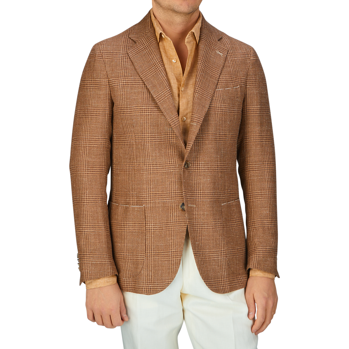 A man showcasing his excellent tailoring skills in a De Petrillo Brown Checked Wool Silk Linen Posillipo Blazer, a mustard shirt, and white trousers.