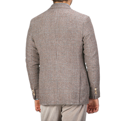 A person wearing a De Petrillo Brown Checked Wool Tweed Posillipo Blazer stands with their back to the camera.