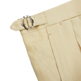 A pair of Caramel Beige Irish Linen Modello B trousers by De Petrillo with a silver buckle.