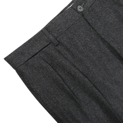 De Petrillo's Charcoal Grey Wool Flannel Modello E Trousers, featuring pleats and a button closure, are showcased from above on a white background.