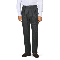 Individual dressed in a white shirt, Charcoal Grey Wool Flannel Modello E Trousers by De Petrillo, and brown loafers, posed against a simple backdrop.