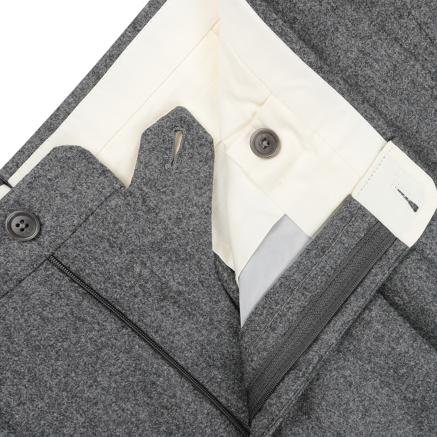 Close-up of De Petrillo's Medium Grey Wool Flannel Modello B Trousers in a slim fit, featuring an open zipper that reveals the waistband, buttons, and inner lining crafted from luxurious Italian wool flannel.