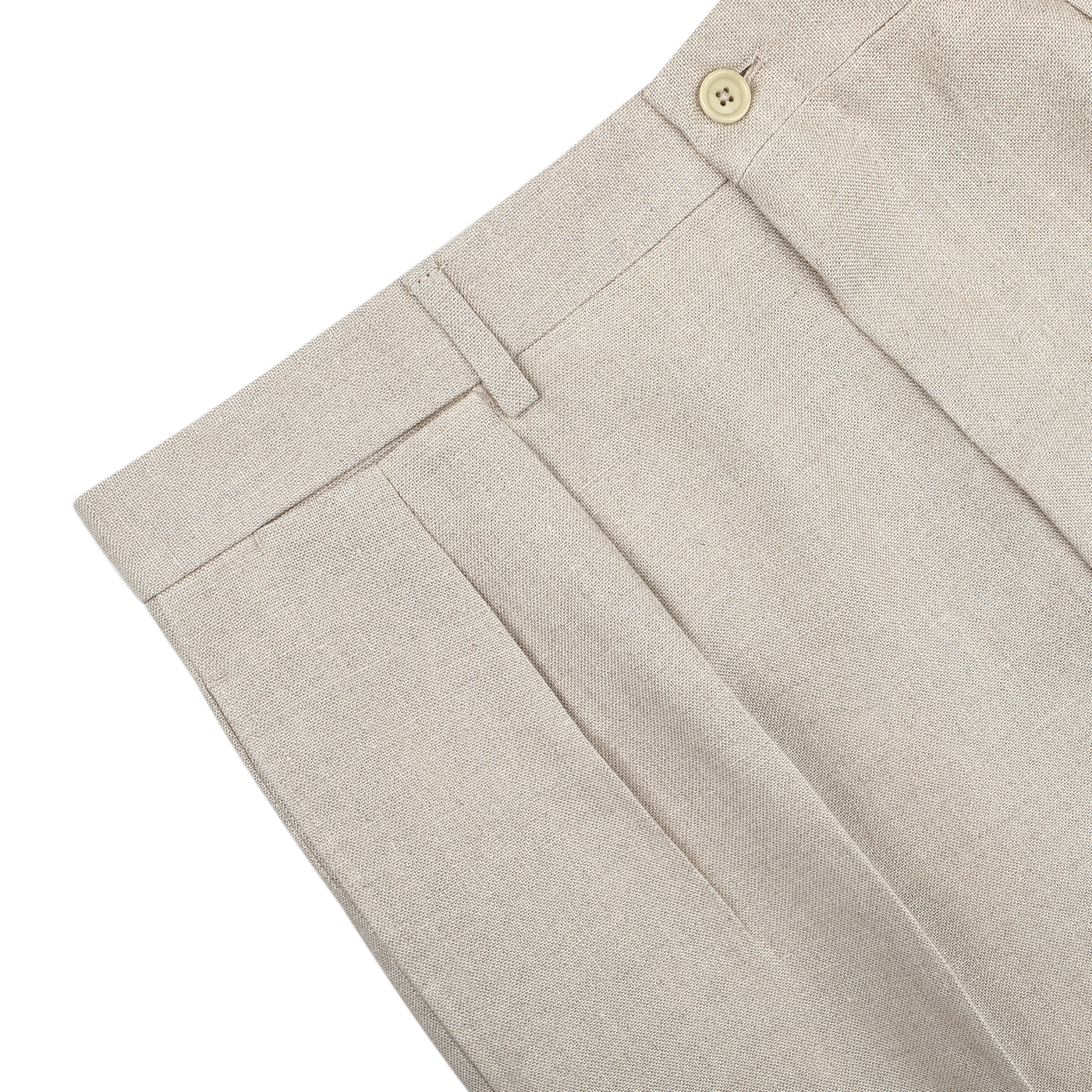 De Petrillo's Sand Beige Irish Linen Modello E Trousers boast a pleated design with button closure and belt loops, displayed elegantly on a light surface.