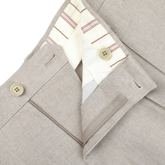 Close-up of De Petrillo's Sand Beige Irish Linen Modello E Trousers with a white and striped inner waistband, two-button closure, and visible buttonholes.