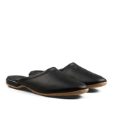 A pair of Derek Rose black leather handmade slip-on shoes on a white background.