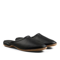 A pair of Derek Rose black leather handmade slip-on shoes on a white background.