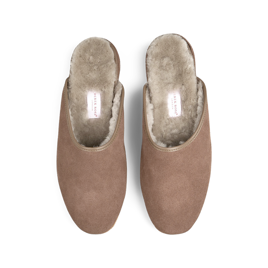 A pair of handmade Taupe Beige Suede Sheepskin Open Slippers by Derek Rose with white fluffy sheepskin lining.